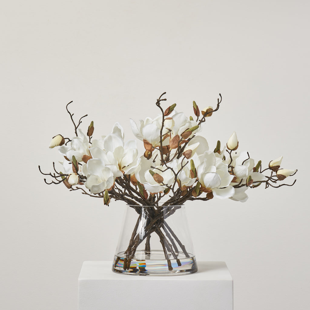 White Magnolia, Mixed Greens & Berry Everyday Winter Floral Arrangement  Centerpiece in Tapered Glass Vase